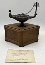 A Toc H "Lamp of Maintenance" bronze oil lamp with inscription and snuffer in shaped oak case