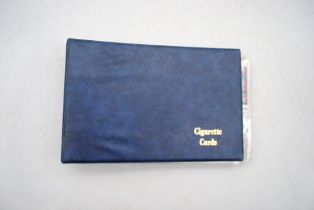 An album of various cigarette cards, including Ogdens etc.