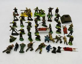 A small collection of army related plastic model figurines including two Britains Deetails on