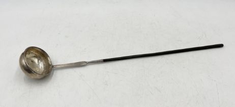 A Georgian unmarked silver toddy ladle