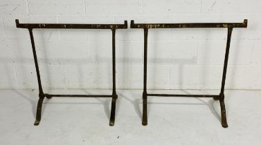 A pair of vintage cast iron trestle table supports