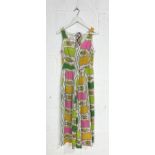 A vintage 1970's jumpsuit by Colin Glascoe with brightly coloured floral design