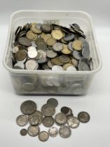 A collection of various worldwide coinage including a small amount of silver
