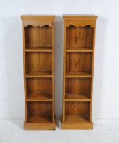 A pair of narrow pine bookcases - length 35.5cm, depth 20.5cm, height 128cm (each)