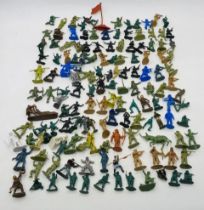 A collection of unpainted plastic toy model figures, mainly relating to the army