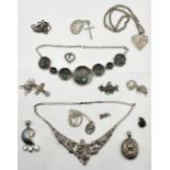 A collection of silver pendants, locket, medallion etc.