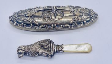 A hallmarked silver nail buffer along with a dog shaped rattle/teether