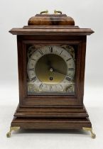 A mahogany cased bracket clock with square brass dial signed Eccles, Bideford and brass carrying