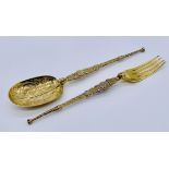 A silver gilt anointing spoon and matching fork, weight 68.8g, London 1910, Cornelius Desomeaux