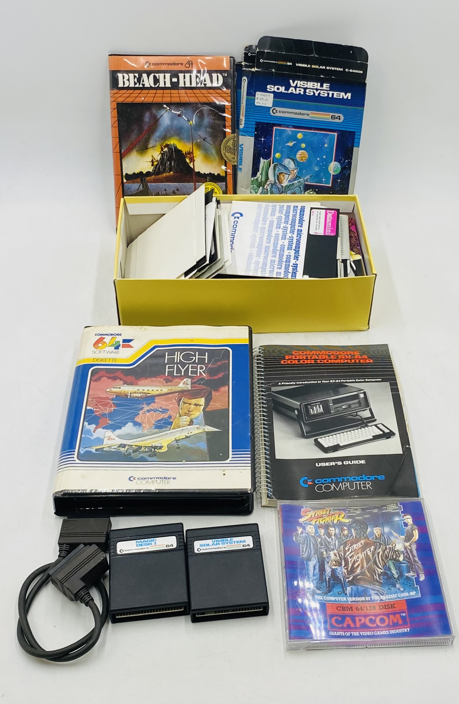 A vintage portable Commodore SX-64 Executive Colour Computer, along with a selection of games on - Image 5 of 7