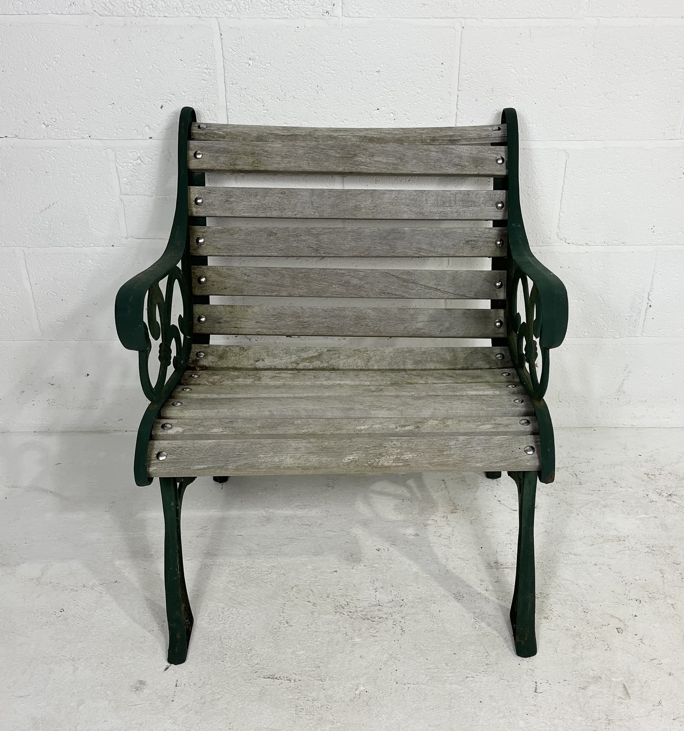 A cast iron garden chair with weathered wooden slatted seat. - Image 2 of 6