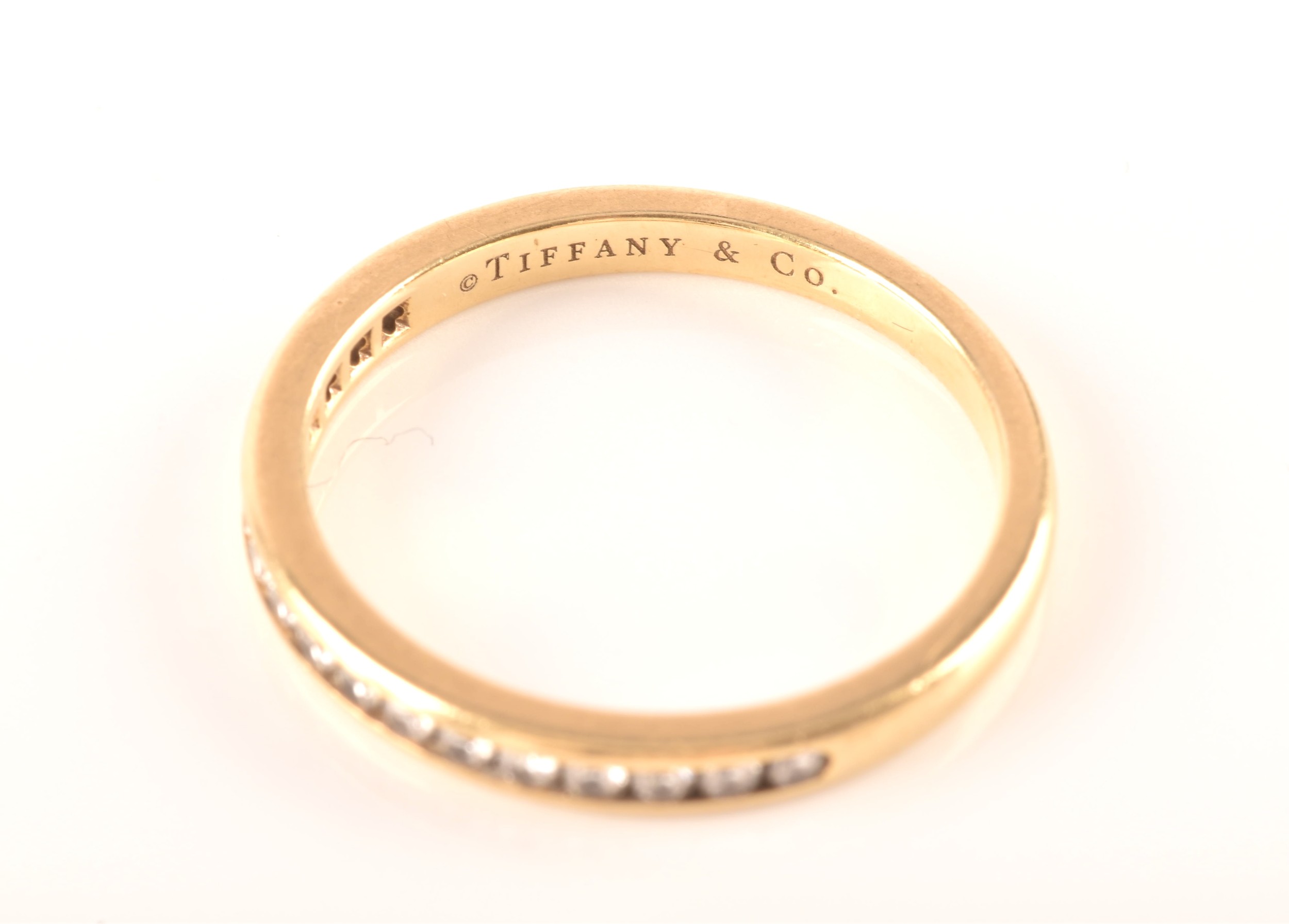 Tiffany & Co. A Lucida 18ct yellow gold diamond half eternity ring, set with 17 brilliant cut - Image 3 of 14