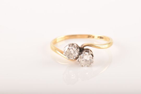 A 18ct yellow gold and platinum two stone ring, set with two brilliant cut diamonds, approximately - Image 2 of 9