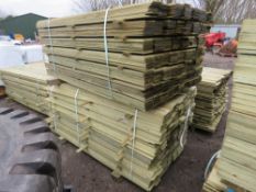 2 X LARGE PACKS OF TREATED HIT AND MISS CLADDING TIMBER BOARDS: 1.75M LENGTH X 100MM WIDTH APPROX.