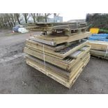 STACK OF ASSORTED TIMBER FENCE PANELS.