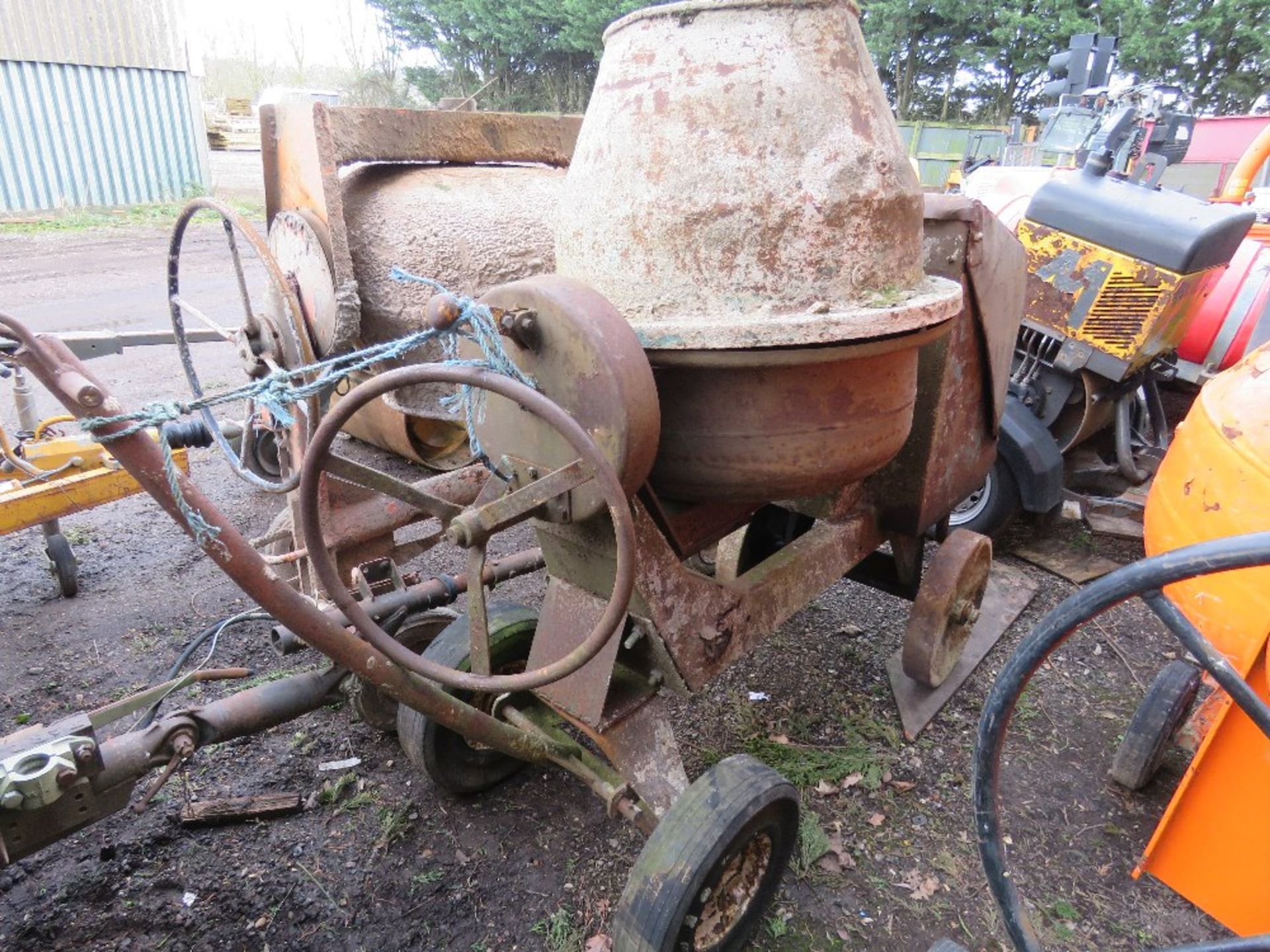 DIESEL ENGINED SITE CEMENT MIXER WITH HANDLE.
