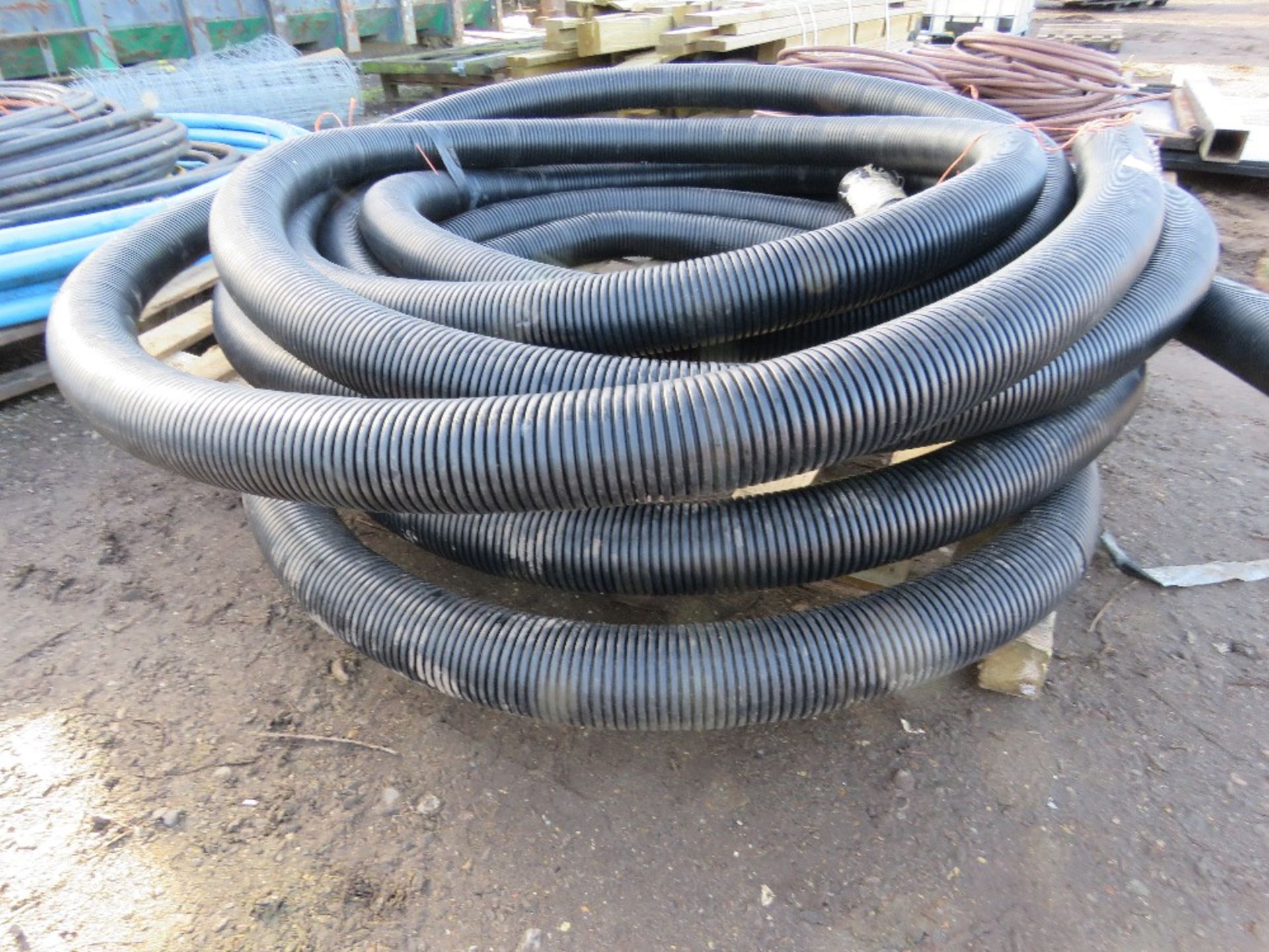 COIL OF DRAINAGE PIPING. THIS LOT IS SOLD UNDER THE AUCTIONEERS MARGIN SCHEME, THEREFORE NO VAT