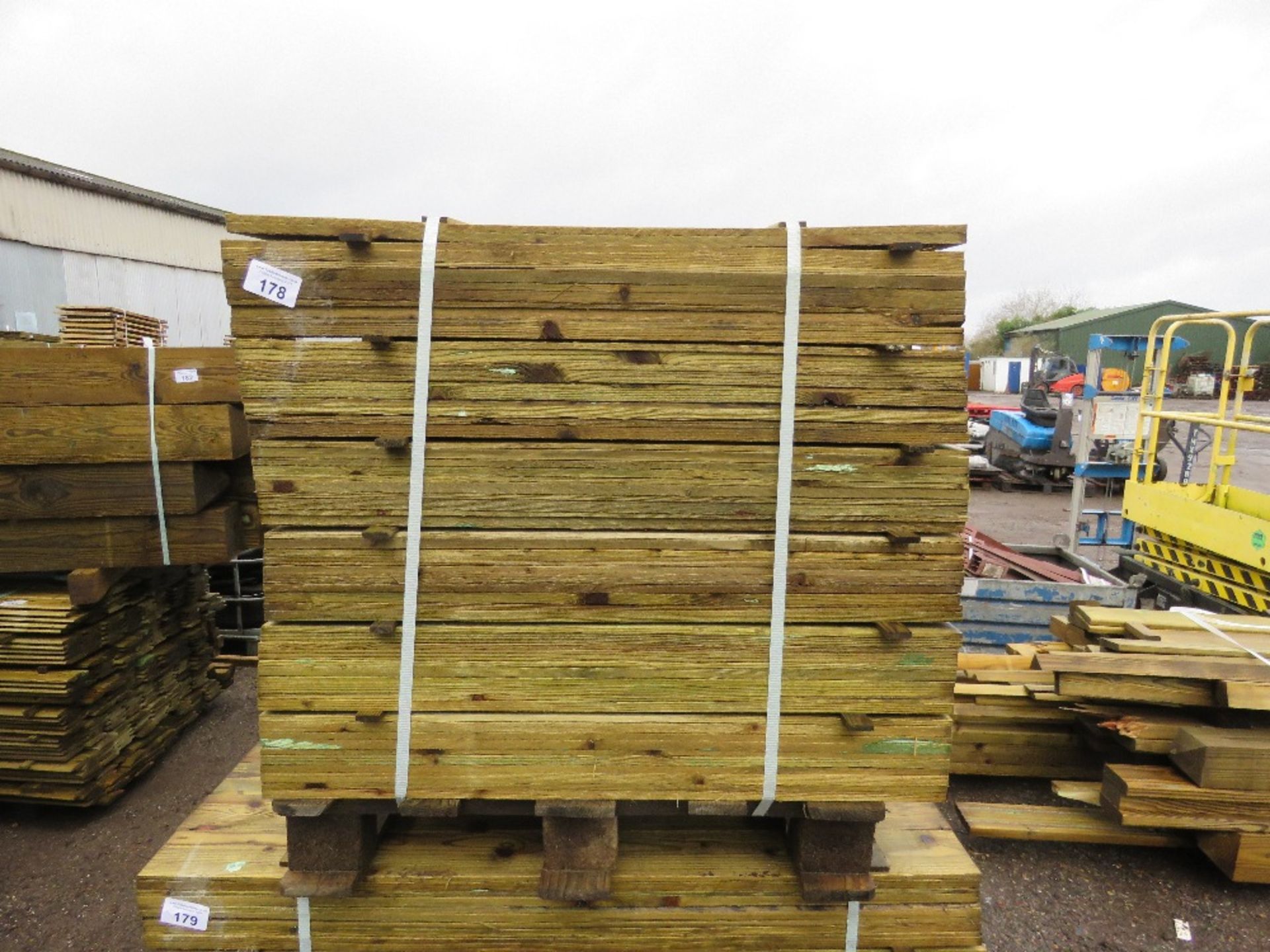 LARGE PACK OF TREATED FEATHER EDGE TIMBER CLADDING BOARDS 0.9M LENGTH X 100MM WIDTH APPROX.