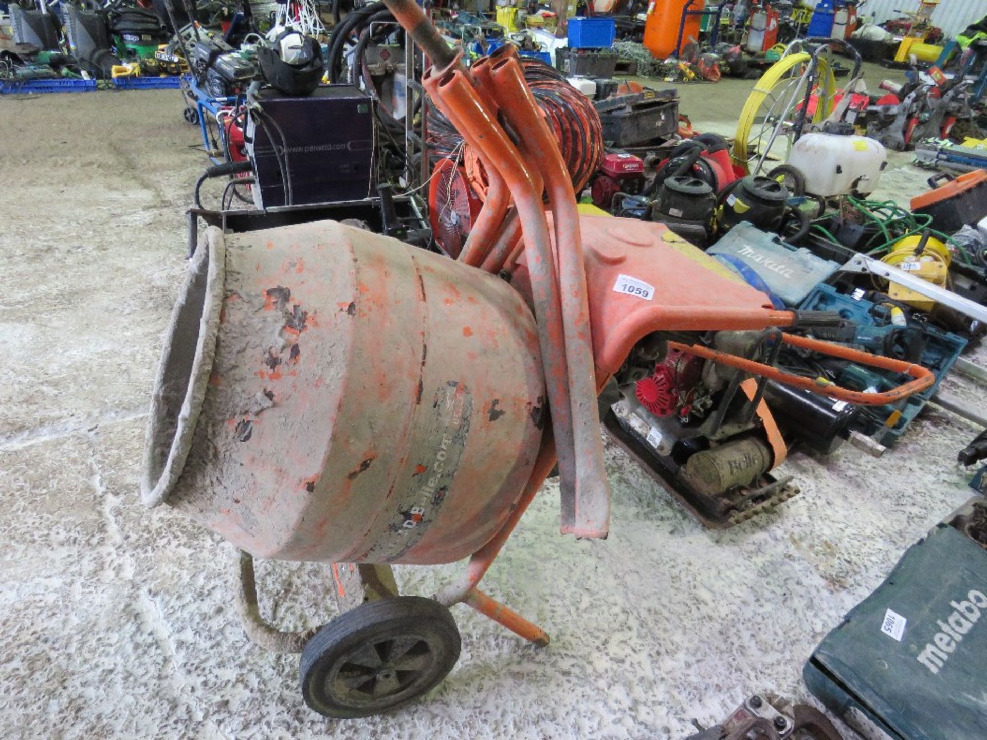 BELLE PETROL ENGINED CEMENT MIXER WITH A STAND.