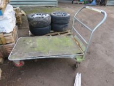 4 WHEELED WHAREHOUSE TROLLEY. THIS LOT IS SOLD UNDER THE AUCTIONEERS MARGIN SCHEME, THEREFORE NO