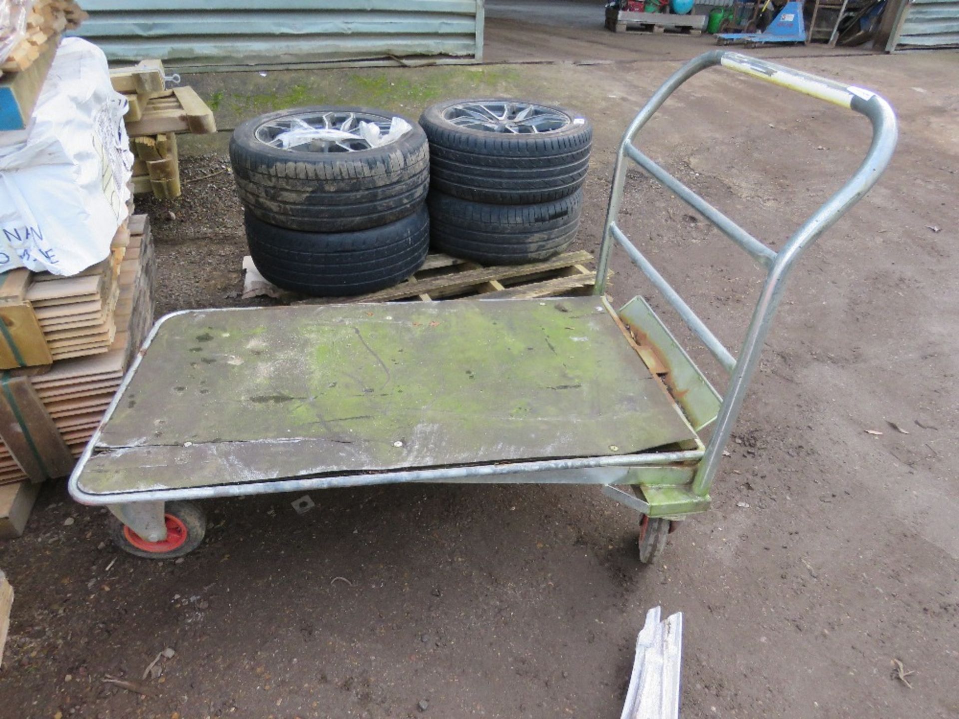 4 WHEELED WHAREHOUSE TROLLEY. THIS LOT IS SOLD UNDER THE AUCTIONEERS MARGIN SCHEME, THEREFORE NO