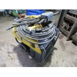 ATLAS COPCO HIGH OUTPUT HYDRAULIC BREAKER PACK WITH HOSE AND GUN. THIS LOT IS SOLD UNDER THE AUCT