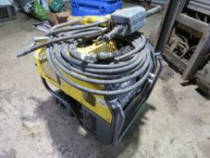 ATLAS COPCO HIGH OUTPUT HYDRAULIC BREAKER PACK WITH HOSE AND GUN. THIS LOT IS SOLD UNDER THE AUCT