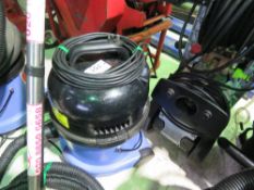 MEDIUM SIZED NUMATIC VACUUM CLEANER WITH HOSE AND HANDLE ATTACHMENT AS SHOWN.