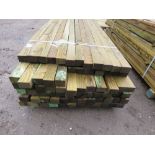 LARGE PACK OF TREATED TIMBER POSTS MAINLY 3" X 2" @ 2.4-2.7M LENGTH APPROX ABOUT 60NO LENGTHS IN TO