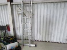 TWO ALUMINIUM LADDER SECTIONS WITH STABILISER BAR. THIS LOT IS SOLD UNDER THE AUCTIONEERS MARGIN SCH