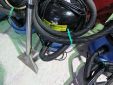 MEDIUM SIZED NUMATIC VACUUM CLEANER WITH HOSE AND HANDLE ATTACHMENT AS SHOWN.