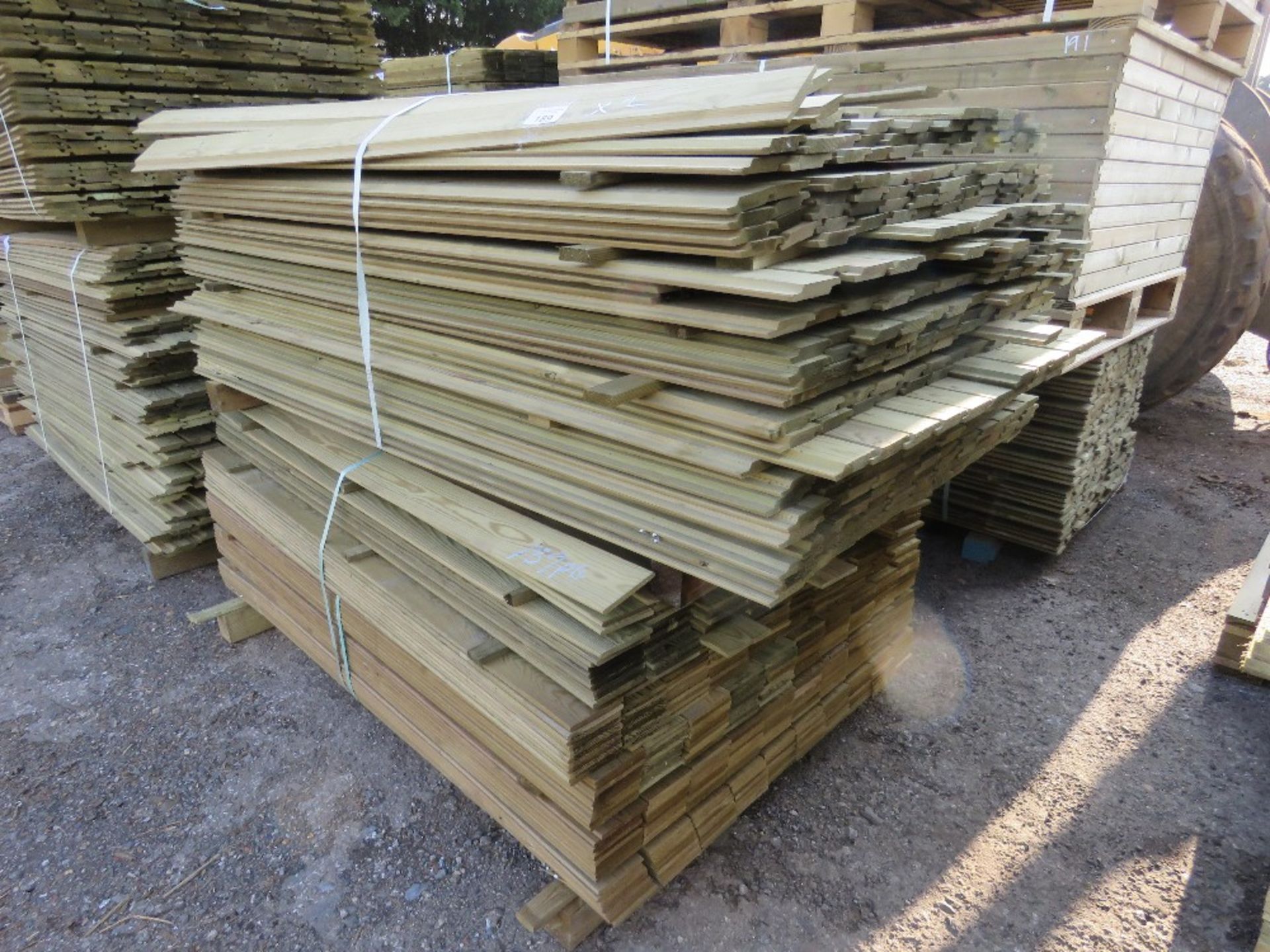 2X LARGE PACKS OF TREATED SHIPLAP AND HIT AND MISS TIMBER CLADDING BOARDS 1.57M-1.73M LENGTH X 100MM