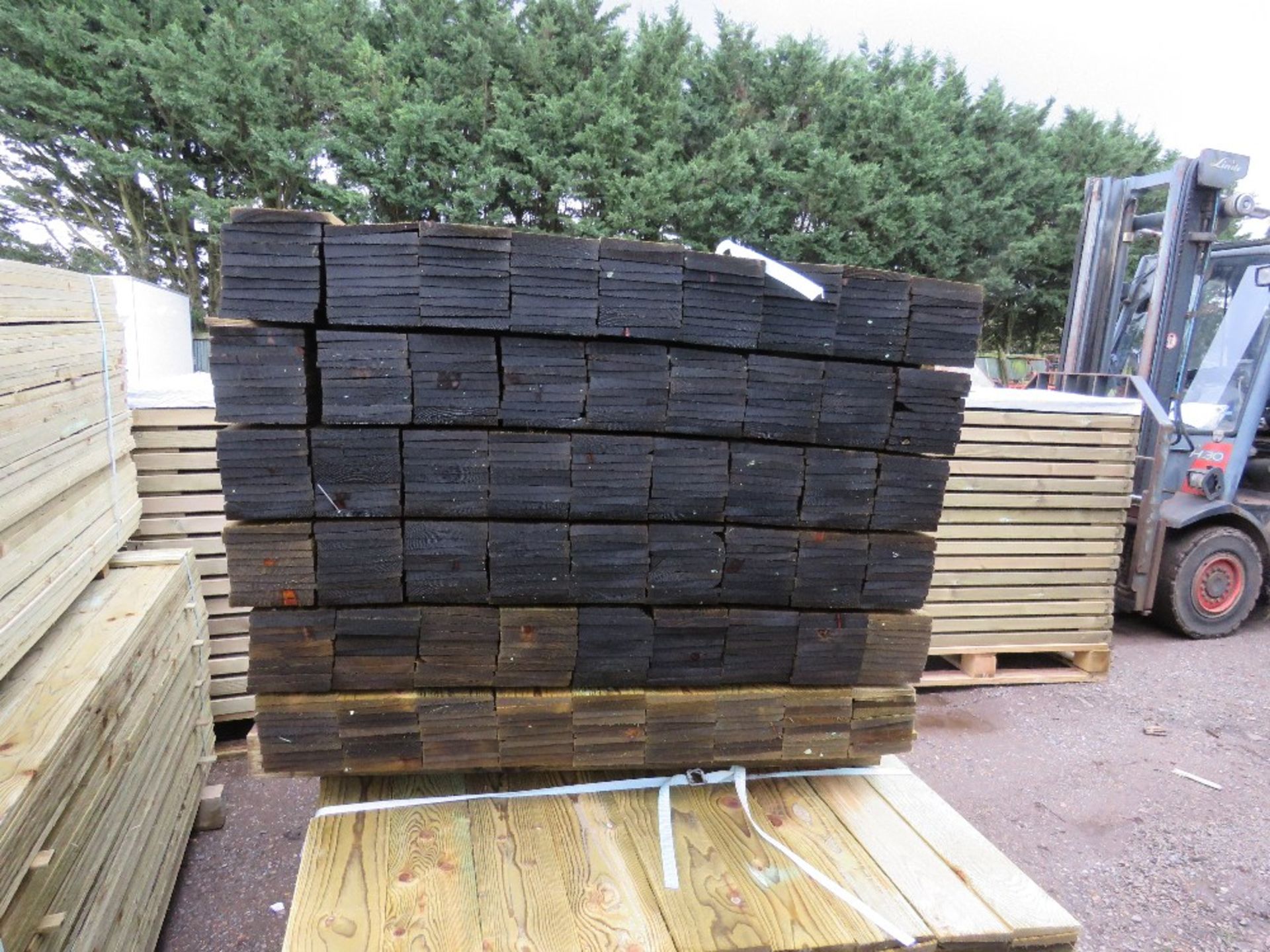 LARGE PACK OF TREATED FEATHER EDGE FENCE CLADDING TIMBER BOARDS. 1.50M LENGTH X 100MM WIDTH APPROX. - Image 2 of 4