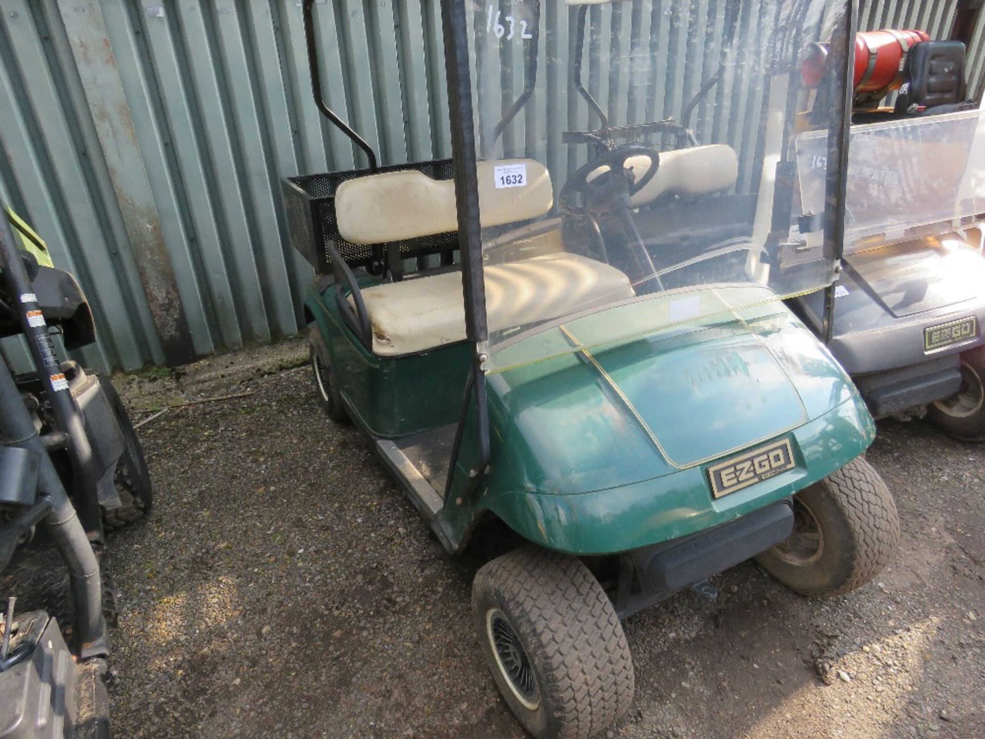 EZGO PETROL ENGINED GOLF BUGGY. GREEN COLOURED. WHEN TESTED WAS SEEN TO RUN, DRIVE, STEER AND BRAKE