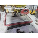 REXON SLIDING HEAD TILE SAW ON LEGS. DIRECT FROM LOCAL RETIRING BUILDER. THIS LOT IS SOLD UNDER