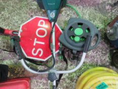 LARGE STRIMMER, STOP SIGN, FUEL TANK AND GARDEN HOSE.....THIS LOT IS SOLD UNDER THE AUCTIONEERS MARG