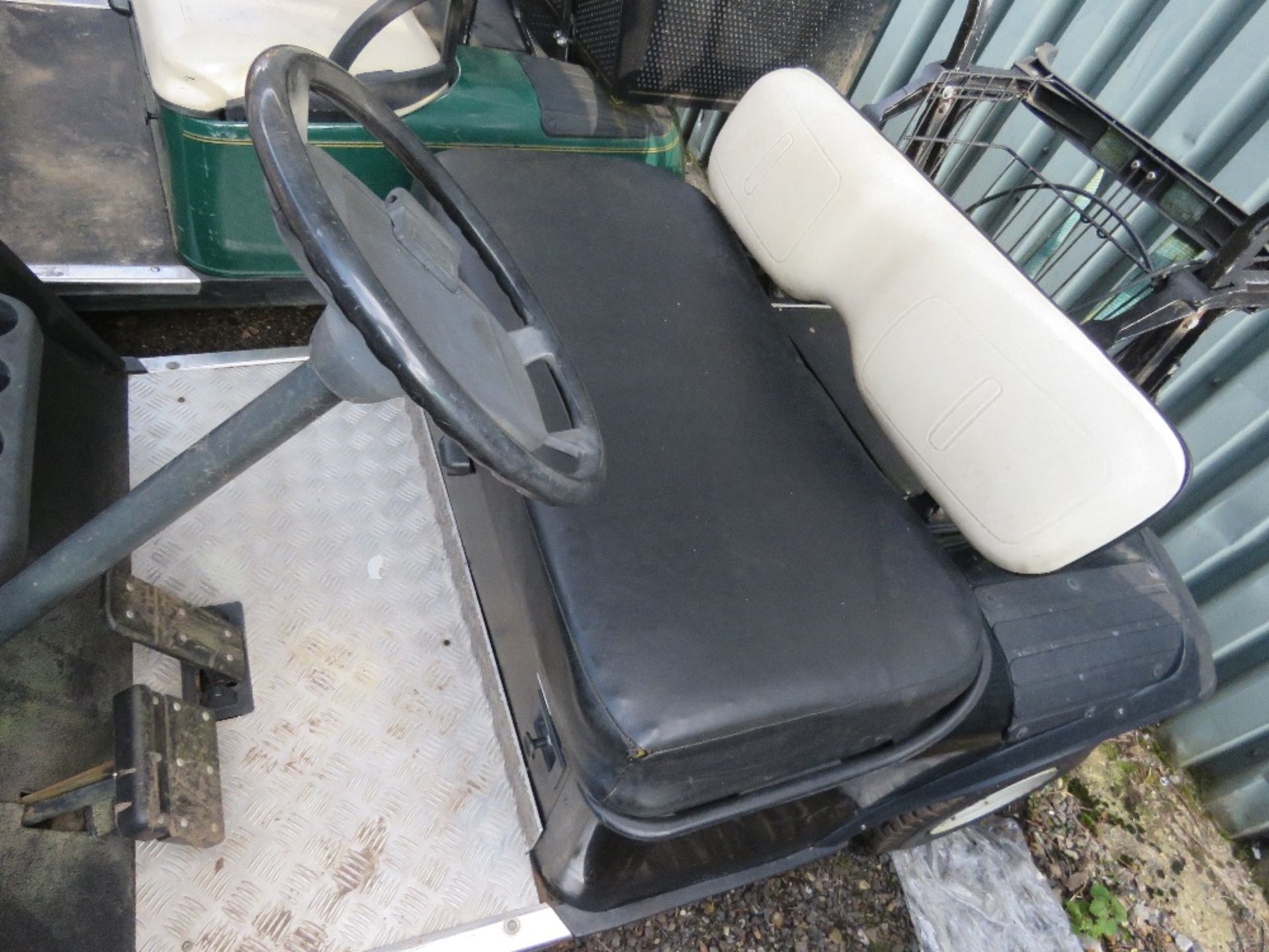 EZGO PETROL ENGINED GOLF BUGGY. BLACK COLOURED. WHEN TESTED WAS SEEN TO RUN, DRIVE, STEER AND BRAKE. - Image 2 of 5