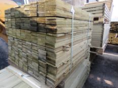 LARGE PACK OF TREATED FEATHER EDGE TIMBER CLADDING BOARDS 1.05M LENGTH X 100MM WIDTH APPROX.