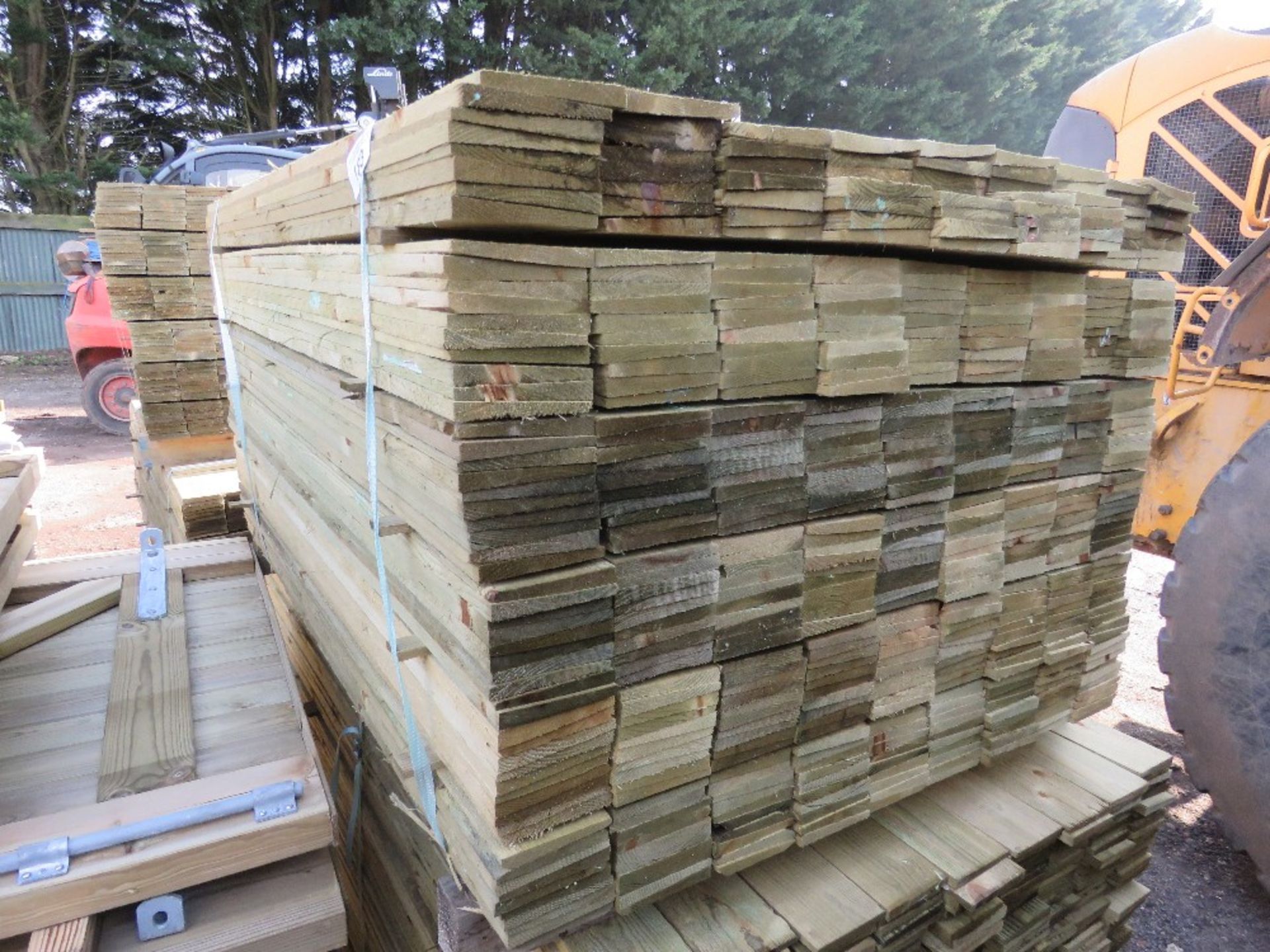 LARGE PACK OF TREATED FEATHER EDGE TIMBER CLADDING BOARDS 1.35M LENGTH X 100MM WIDTH APPROX.