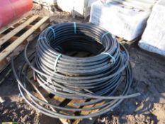 QUANTITY OF BLACK PLASTIC WATER PIPING. THIS LOT IS SOLD UNDER THE AUCTIONEERS MARGIN SCHEME, THE