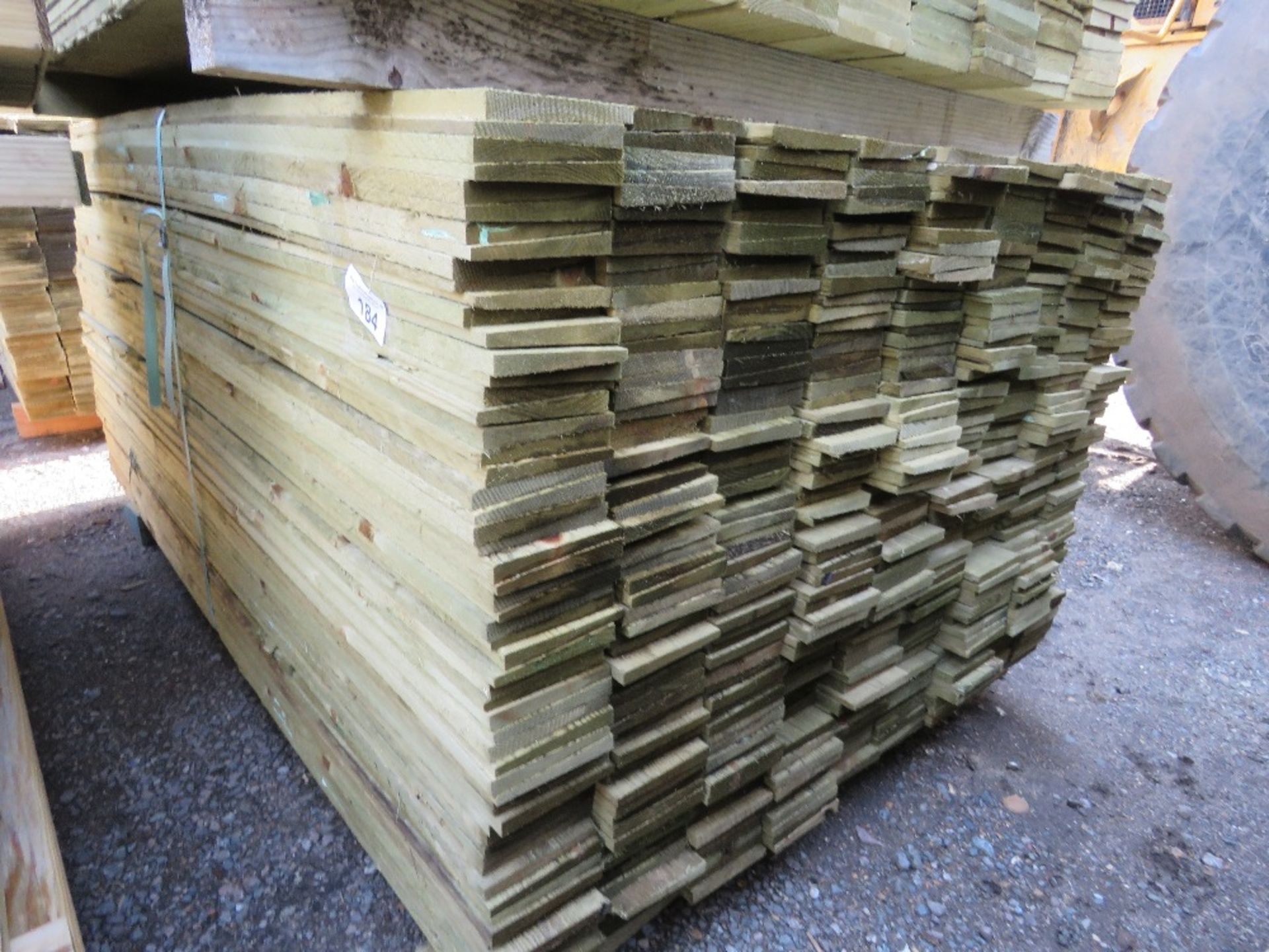 LARGE PACK OF TREATED FEATHER EDGE TIMBER CLADDING BOARDS 1.65M LENGTH X 100MM WIDTH APPROX.