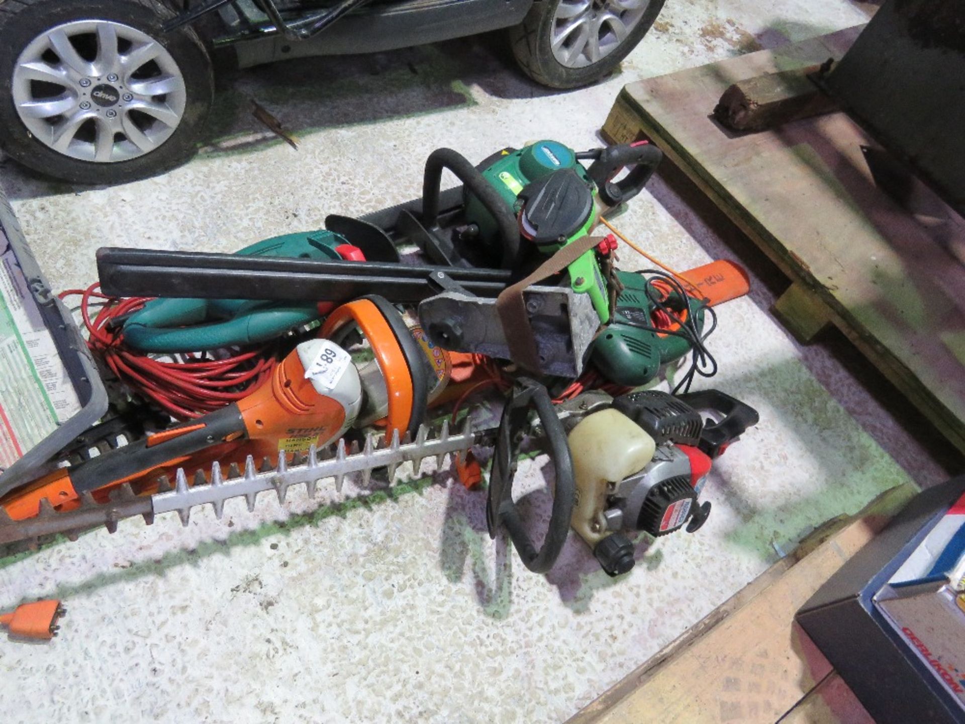 2 X PETROL HEDGE CUTTERS PLUS 2 X ELECTRIC HEDGE CUTTERS AND A CHAINSAW SHARPENER.