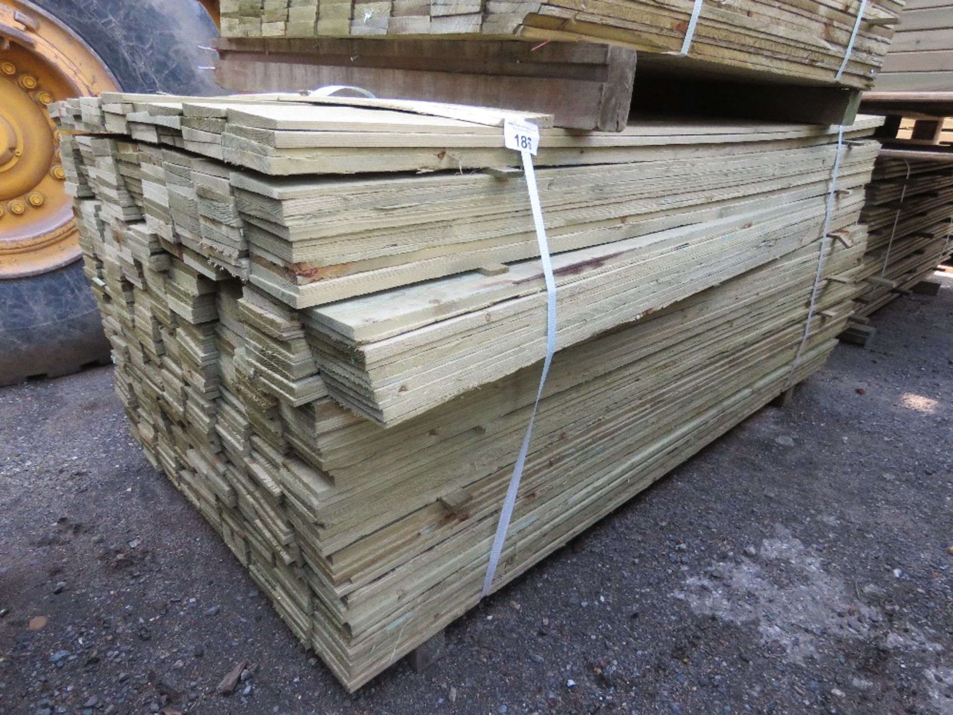 LARGE PACK OF TREATED FEATHER EDGE TIMBER CLADDING BOARDS 1.8M LENGTH X 100MM WIDTH APPROX.