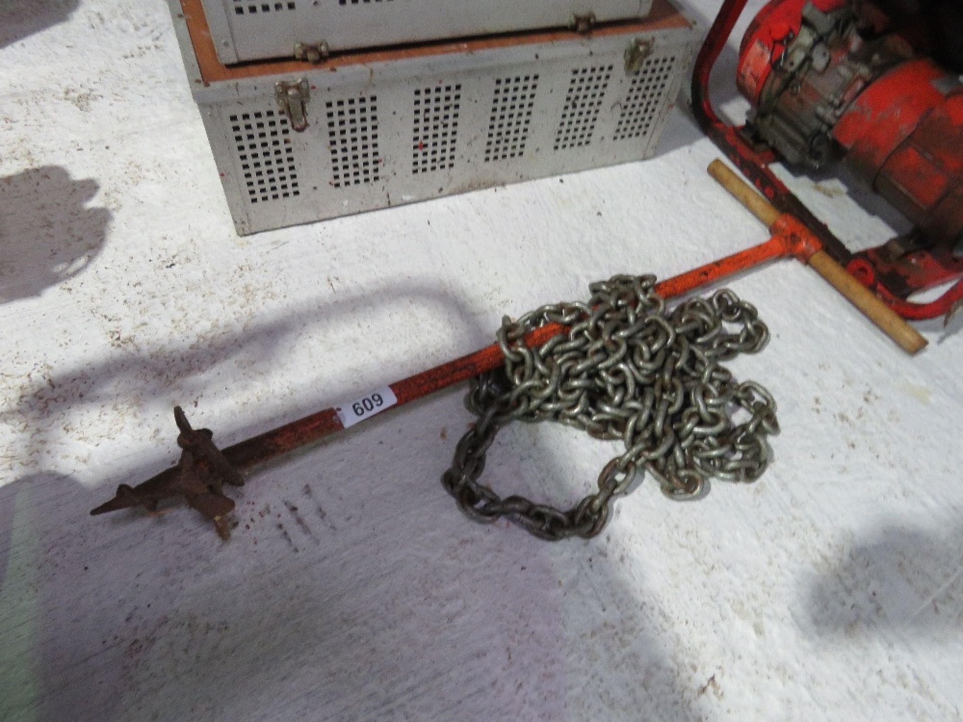 POST HOLE BORER PLUS A SECURING CHAIN.OWNER RETIRING. THIS LOT IS SOLD UNDER THE AUCTIONEERS MARG