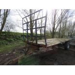 SINGLE AXLED FLAT BED BALE TRAILER, 20FT X 8FT BED APPROX ON SUPER SINGLE WHEELS.....THIS LOT IS SOL