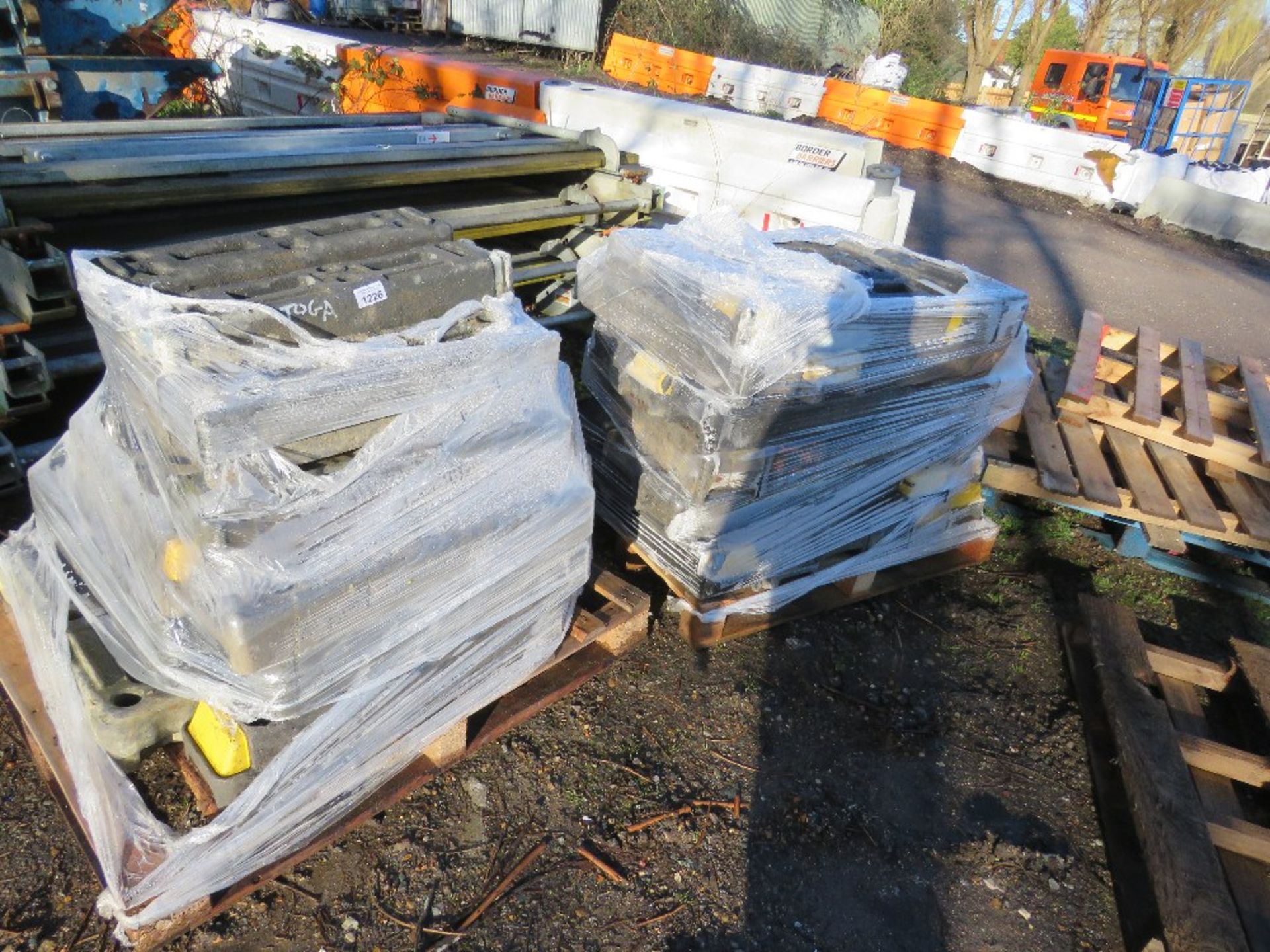2 X PALLETS OF HERAS TYPE SITE FENCE BASES / BLOCKS.