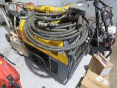 ATLAS COPCO HIGH OUTPUT HYDRAULIC BREAKER PACK WITH HOSE AND GUN. THIS LOT IS SOLD UNDER THE AUCT