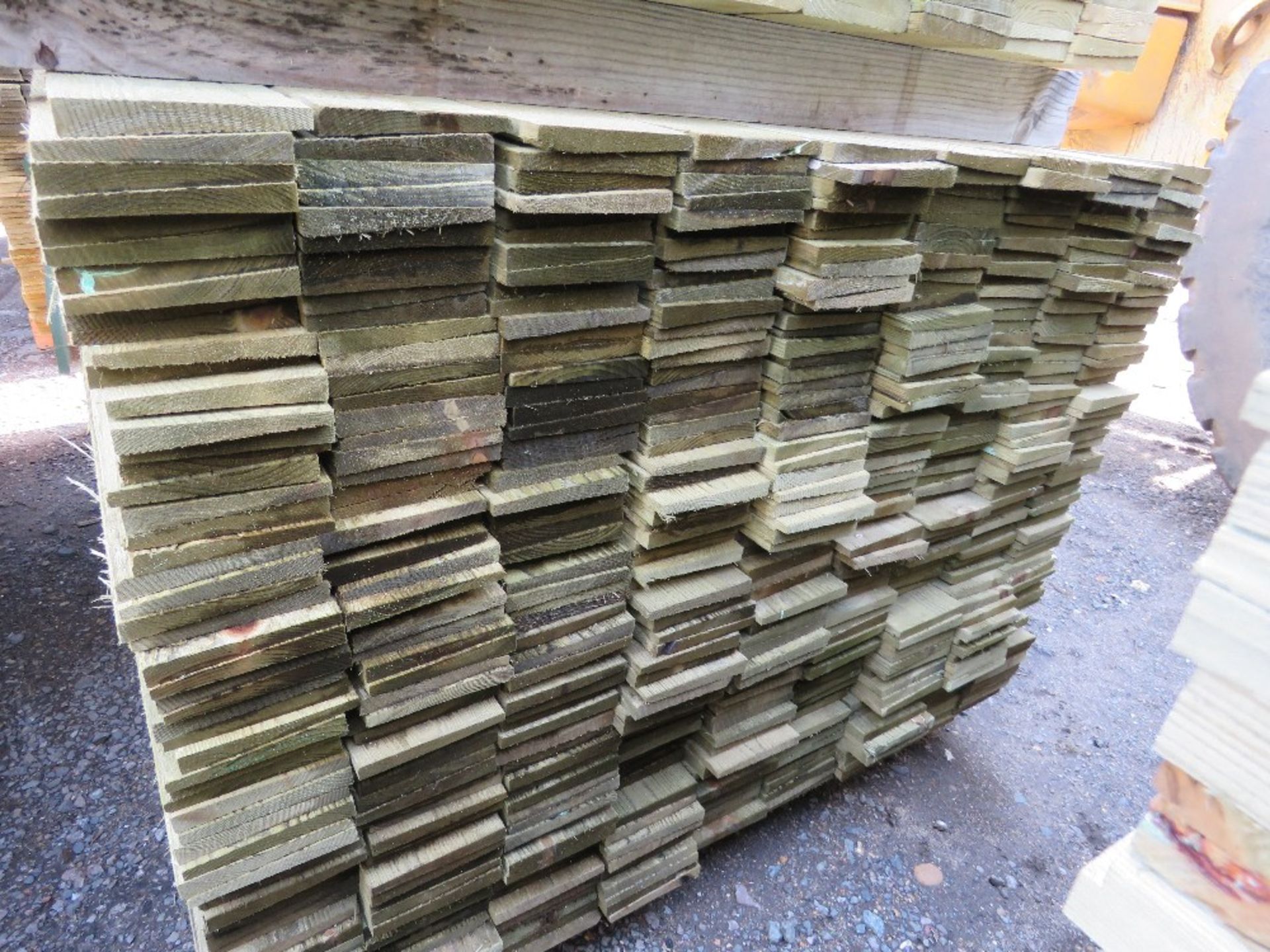 LARGE PACK OF TREATED FEATHER EDGE TIMBER CLADDING BOARDS 1.65M LENGTH X 100MM WIDTH APPROX. - Image 2 of 3