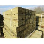 LARGE PACK OF TREATED FEATHER EDGE TIMBER CLADDING BOARDS 1.2M LENGTH X 100MM WIDTH APPROX.