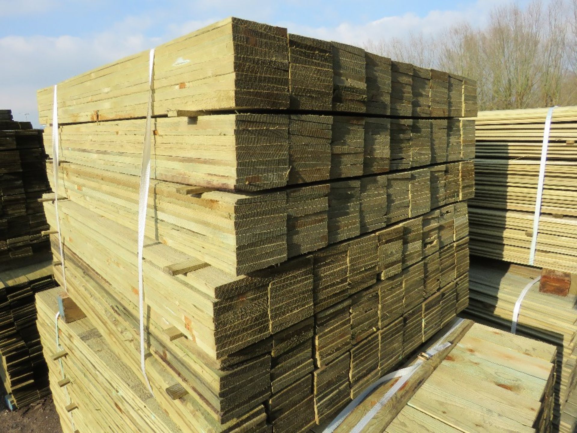 LARGE PACK OF TREATED FEATHER EDGE TIMBER CLADDING BOARDS 1.2M LENGTH X 100MM WIDTH APPROX.